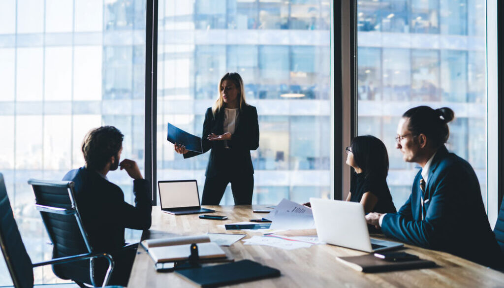 A corporate team having a meeting in a high-rise building
