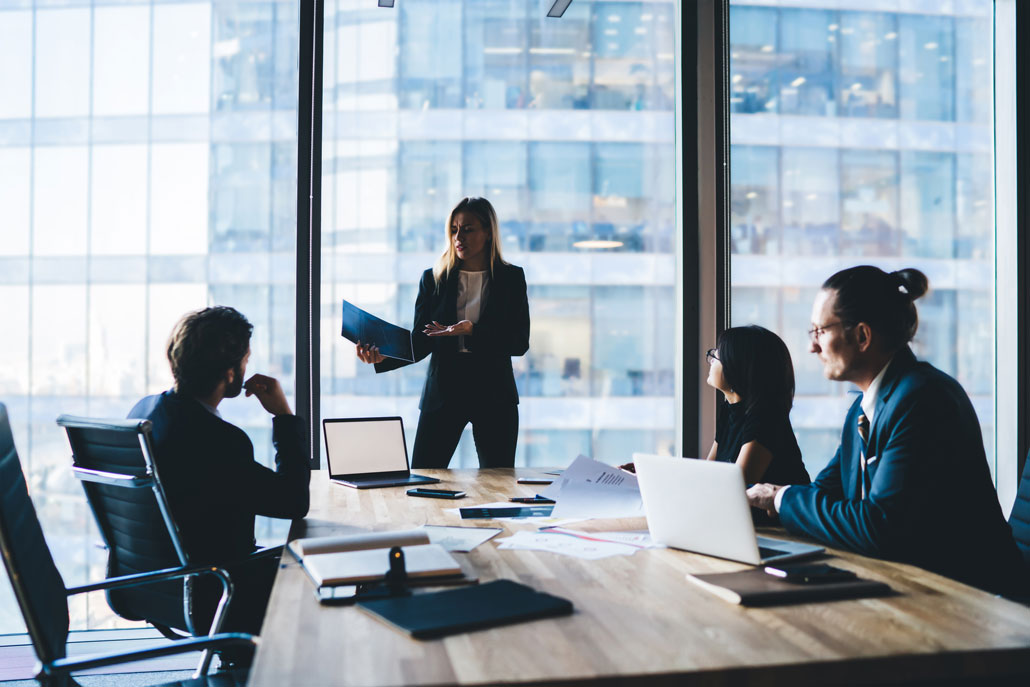 A corporate team having a meeting in a high-rise building