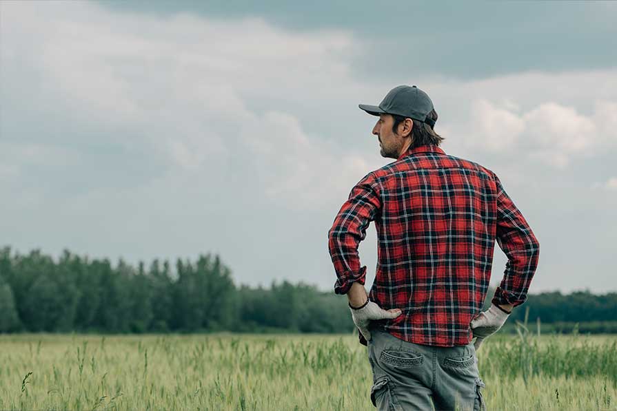 farmer standing in field