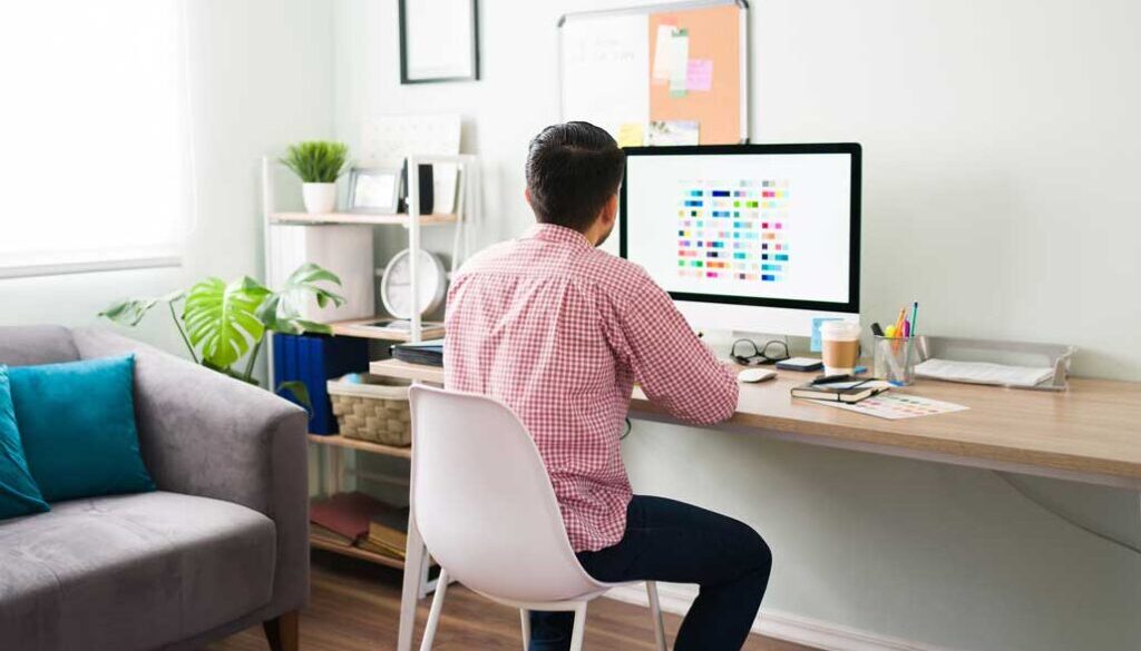 Man working at desk with computer