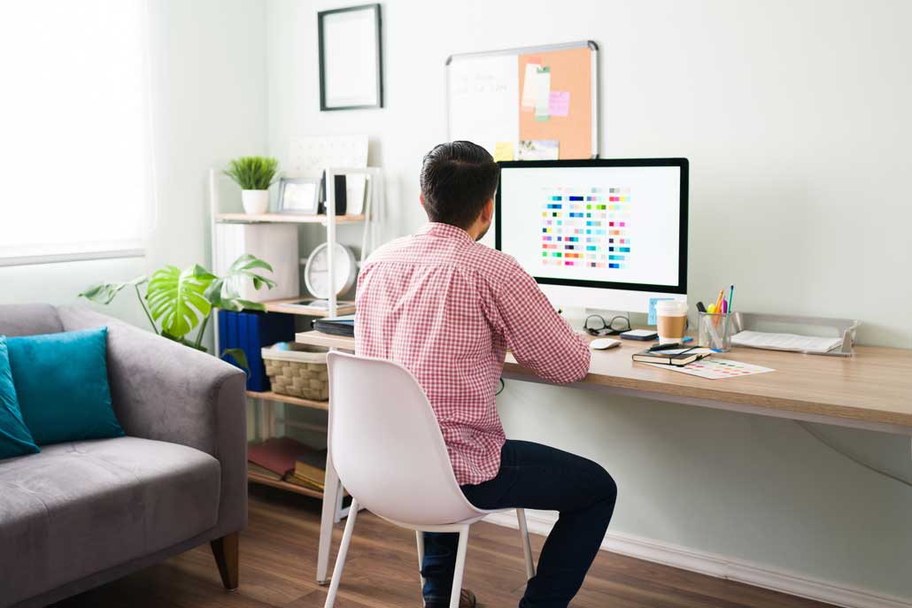 Man working at desk with computer