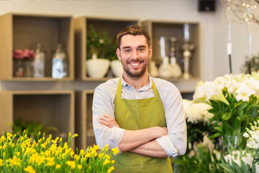 small florist business with man smiling